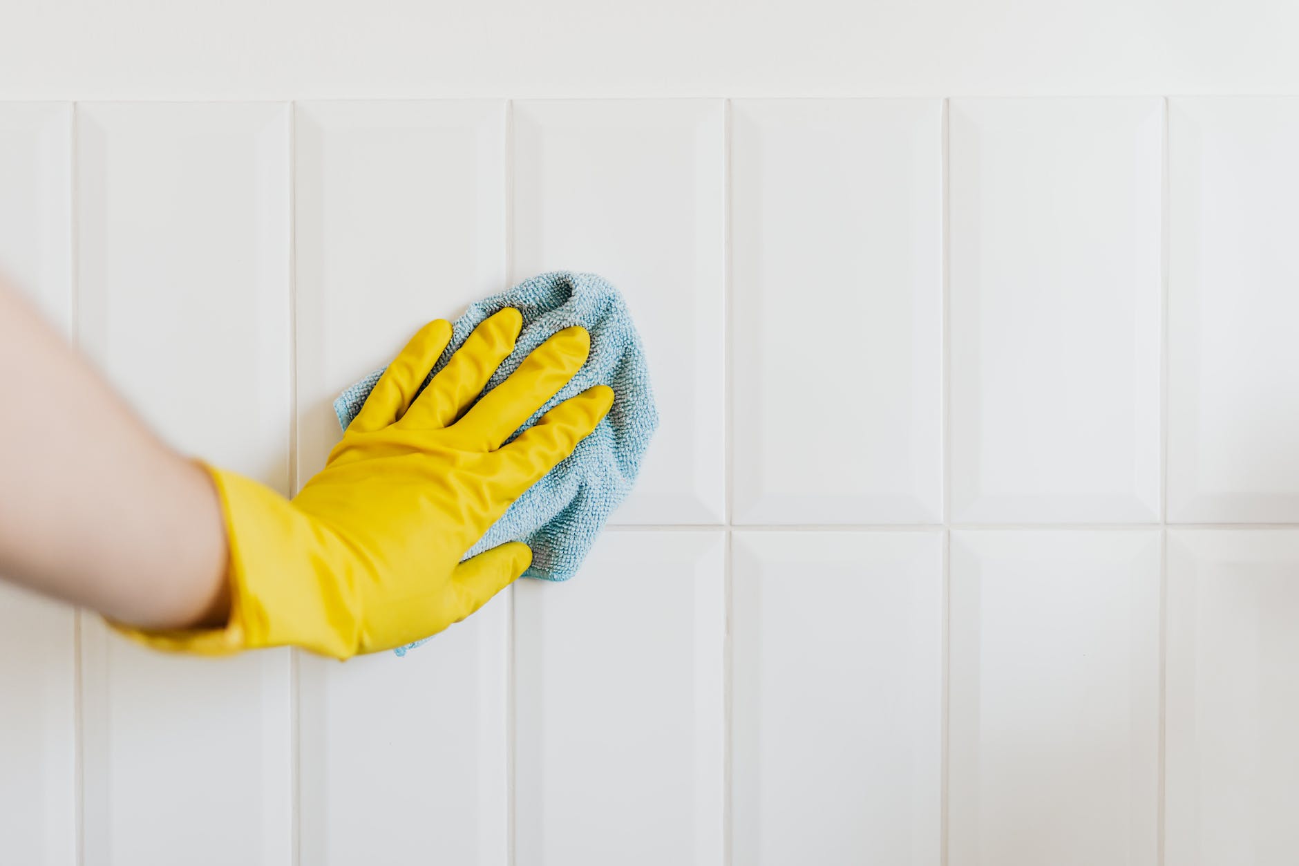 pexels photo 4239033 crop person cleaning tiles with rag