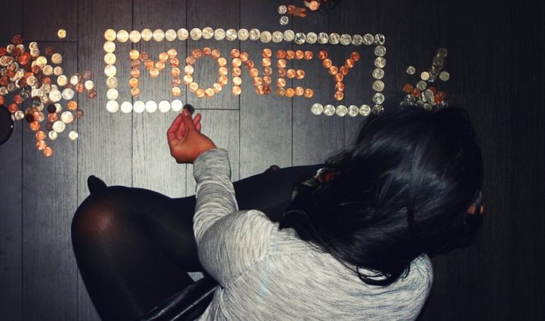 woman arranging coins