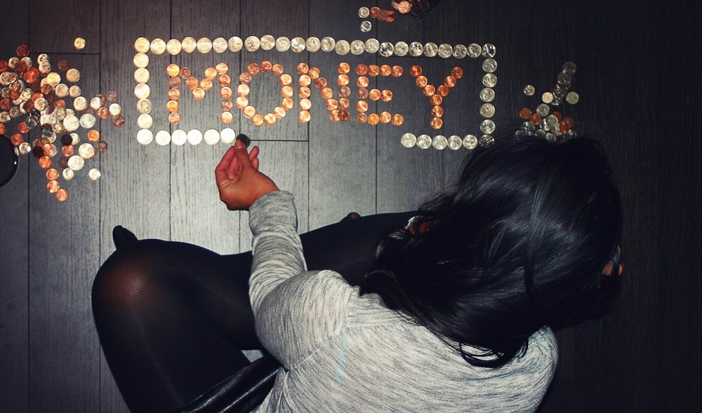 woman arranging coins