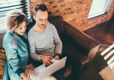 mother son reviewing finances and debt