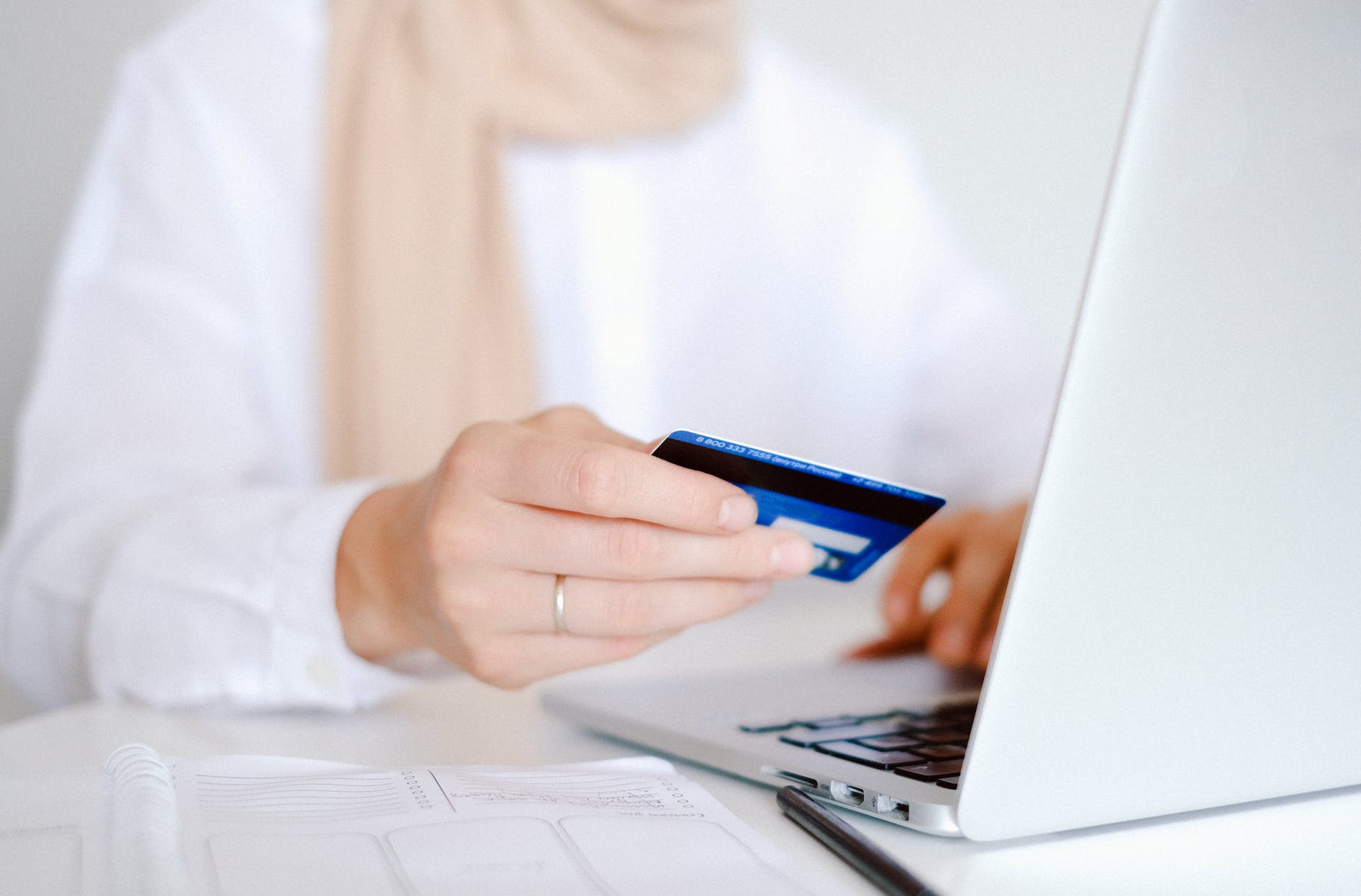 pexels photo 4482896 person in white long sleeve shirt holding credit card